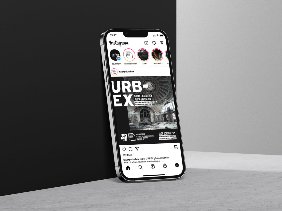 An iPhone leaning against a wall showing the social media post for the Urban Exploration Photo Exhibition organised by Luxexpo The Box.