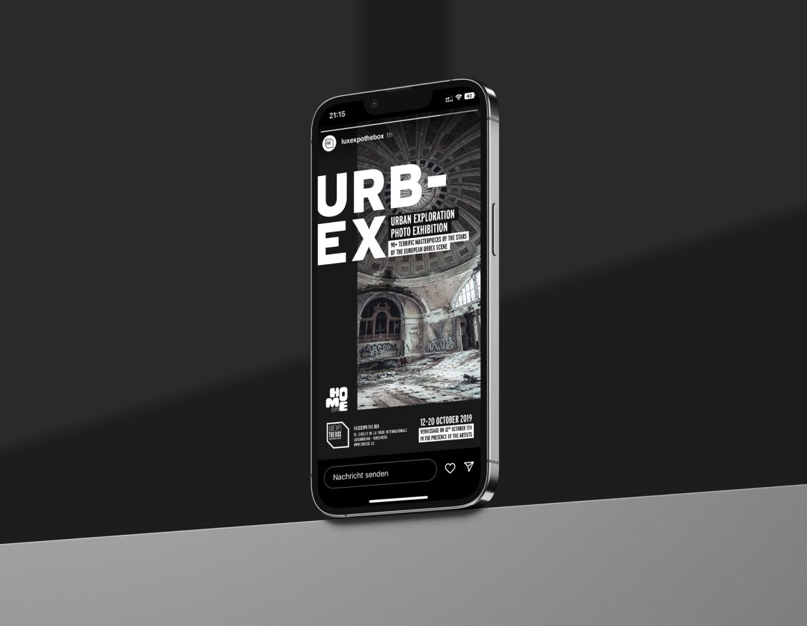 An iPhone standing on a shelf showing the social media story for the Urban Exploration Photo Exhibition organised by Luxexpo The Box.