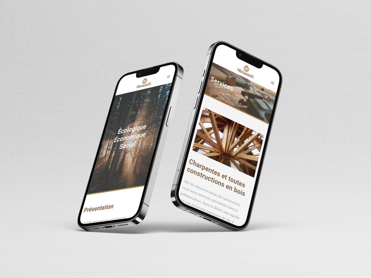 iPhones showing the homepage and services of Holzbau Heidesch.