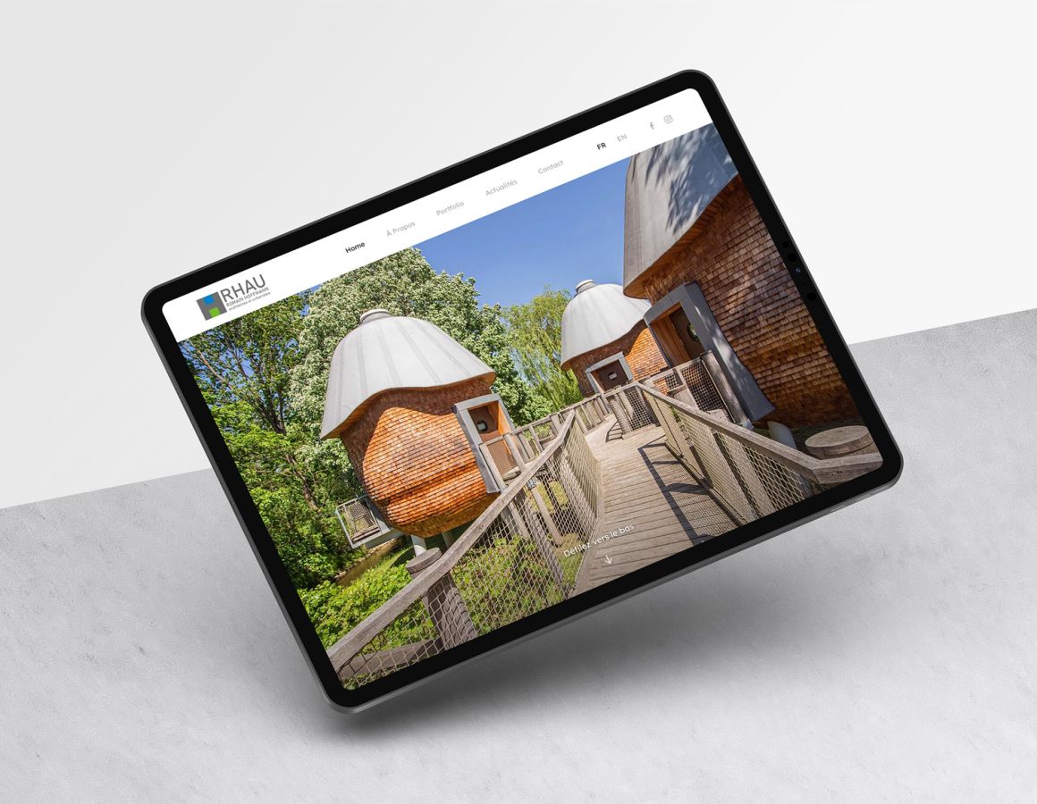iPad showing the Ecolodges Mushrooms in Useldange on the RHAU website.