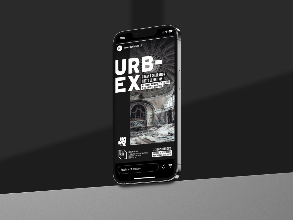 An iPhone standing on a shelf showing the social media story for the Urban Exploration Photo Exhibition organised by Luxexpo The Box.