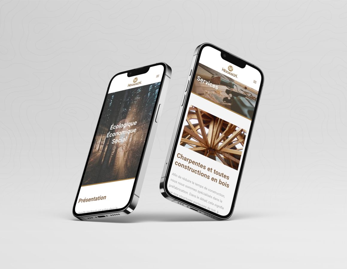 iPhones showing the homepage and services of Holzbau Heidesch.